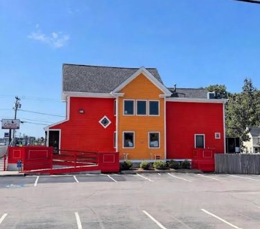 Commercial building with red and orange exterior